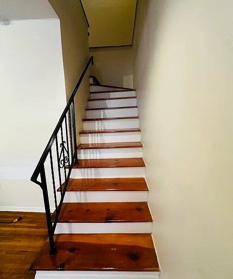 Stairs leading from first floor living room to second floor