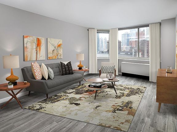 Renovated Package II living room with hard surface plank flooring