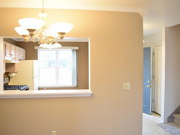 Kitchen view through serving are. This are could serve as a