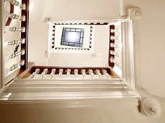Stairway with view of skylight