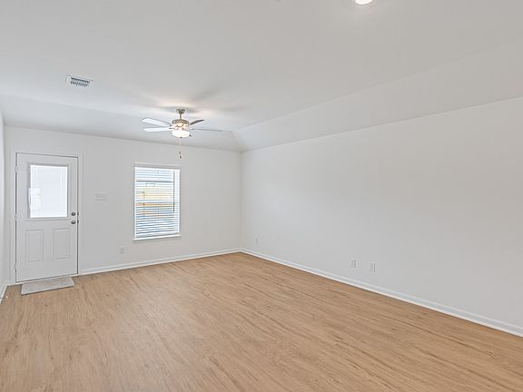 The spacious family room has backyard access.