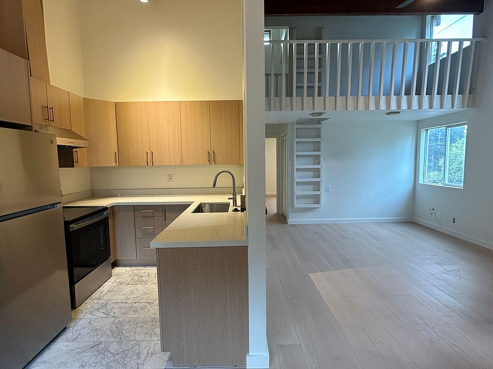 View from dinning area looking at the kitchen and living area