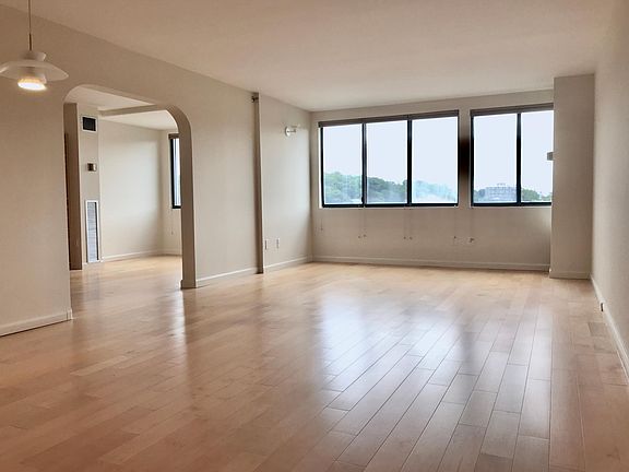 Living room (room is spacious and can also be a living room and dining room). Easter exposure with unencumbered view of the Boston skyline.