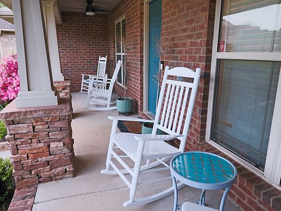 Beautiful front porch with plenty of seating.
