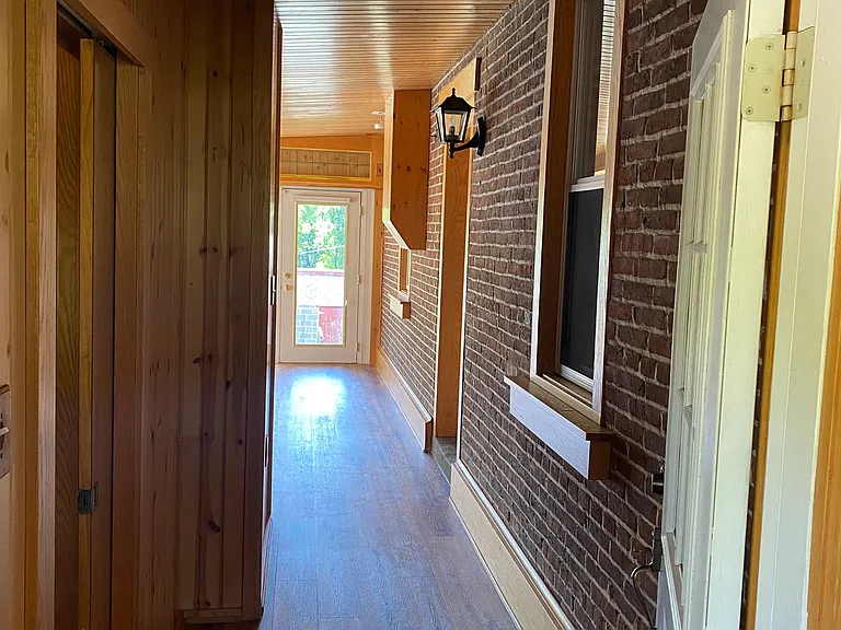 Hallway from Rear Entrance to Sunroom Area