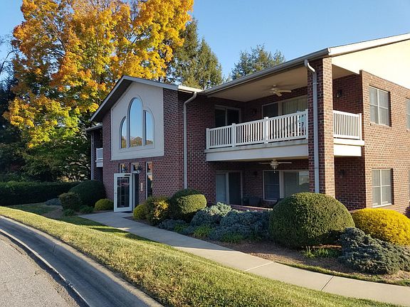 This condo is the one on the top right. Large arched windows are in the common area outside top two condos.