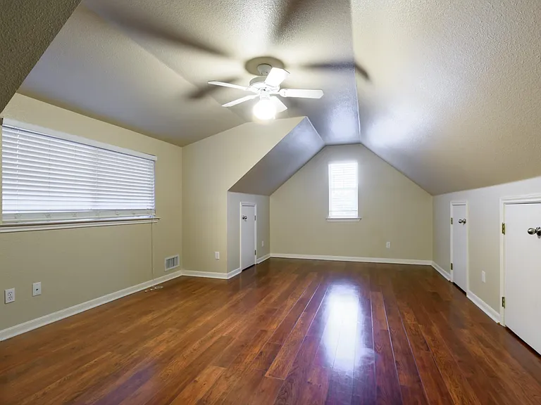 Upstairs bonus room with tons of storage.