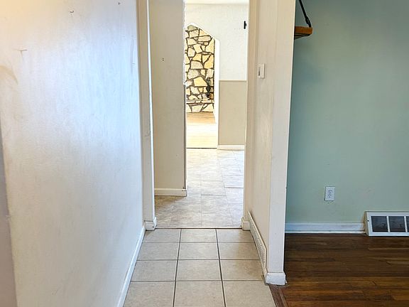 Hallway entry. Tile floor. Dimensions are 12x5