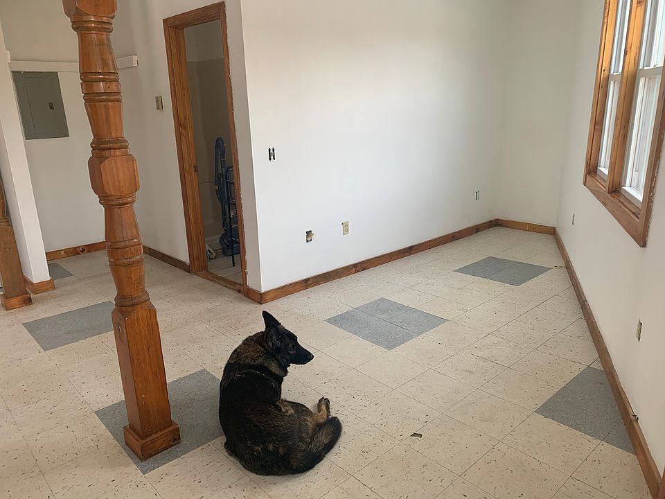 living area with bathroom door (dog not included)