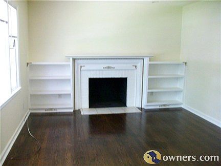 Living room with fireplace and book shelves