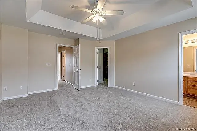 Primary bedroom with walk-in closet
