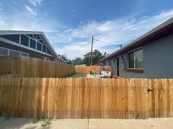Gated backyard with side entrance to home