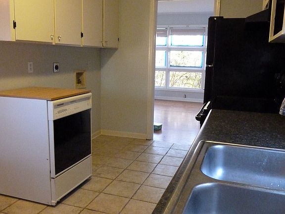 kitchen opens off den. also has a portable dishwaher