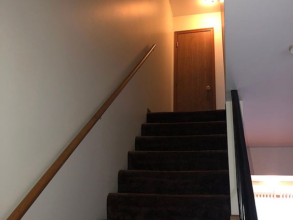 stairs to bedrooms amd full bath plus linen closet