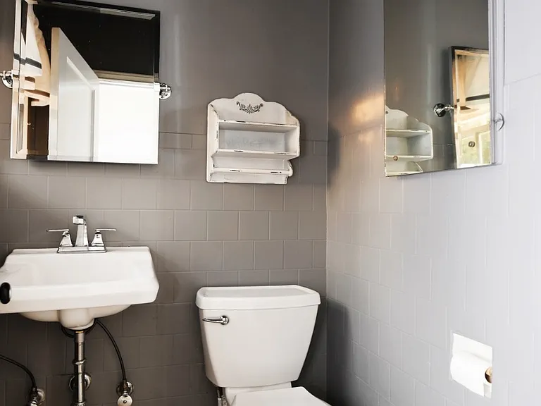 Unit B half bath by entry way on ground level.