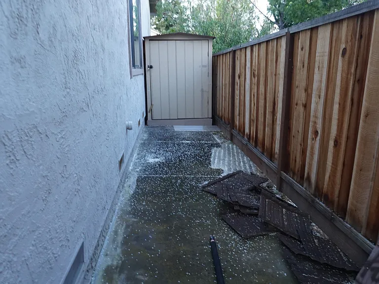 storage shed on right side (will be locked) contains cardboard boxes of audio gear