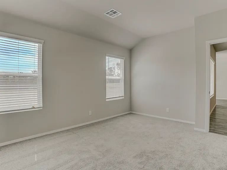 Taken from inside the master suite looking towards the backyard and the living room. Bedroom 1 of 4