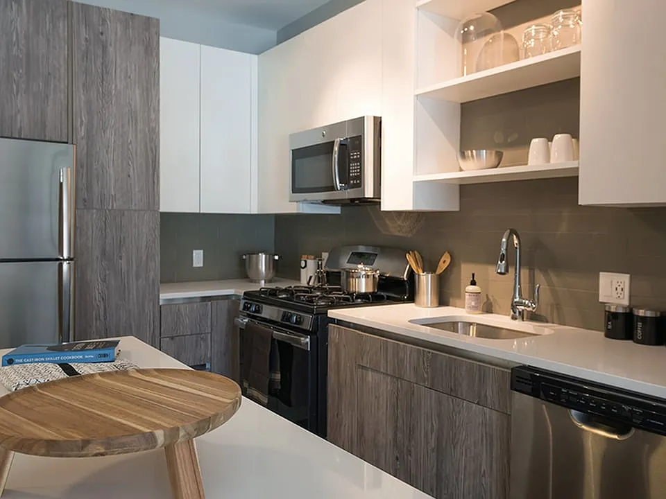 Two tone cabinetry with ample storage options including pantry