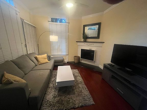 The top of the coffee table lifts up and toward the couch for storage within and for eating upon if desired.