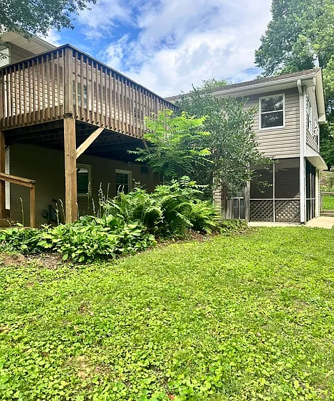 Large fenced in back yard, extra large deck off the main living area with winter mountain view. Screened porch downstairs.