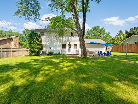 A beautiful, full fenced flat backyard - perfect for kids and dogs to enjoy. There's even a swingset and slide not pictured here!