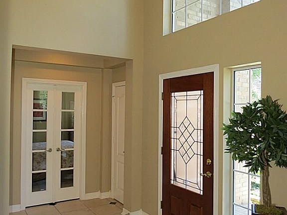 2 Story Ceiling in Entry Hall, Double French Doors lead to Study