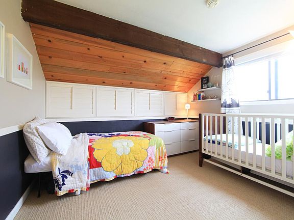 Second bedroom features levered shutters that open up to the