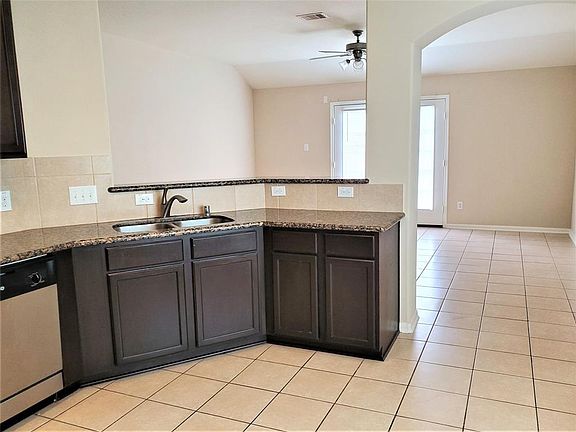 Set at breakfast bar open concept to livingroom/family room