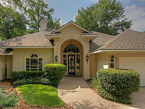 This 3 bedroom, stucco home has a 2-car garage and spa with rock waterfall.