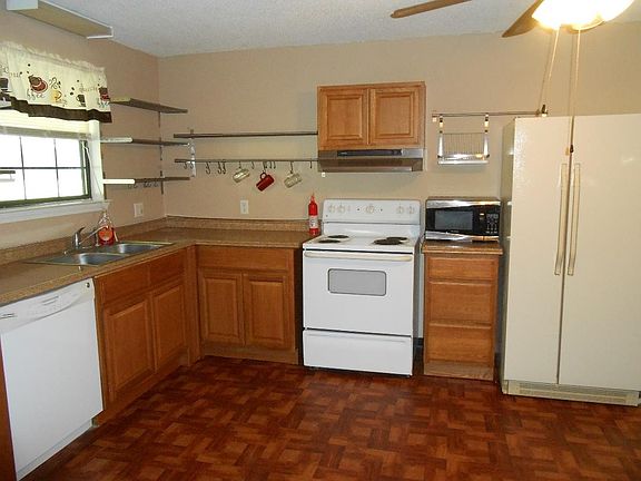 Kitchen large eat in with sunny window. Dishwasher.