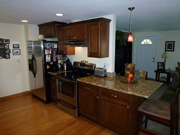 Kitchen view, opens to generous family room. Plenty of room for all your furniture. Light and Bright!