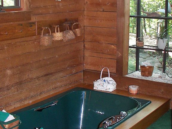 Master bath with sunken tub, large shower and two walk-in closets