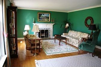 Expansive living room has a fireplace