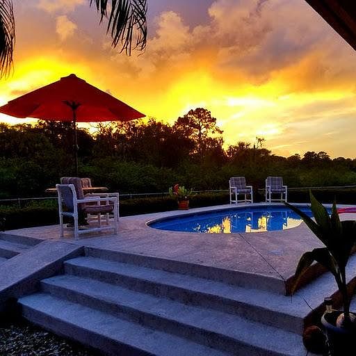 sunset by the pool