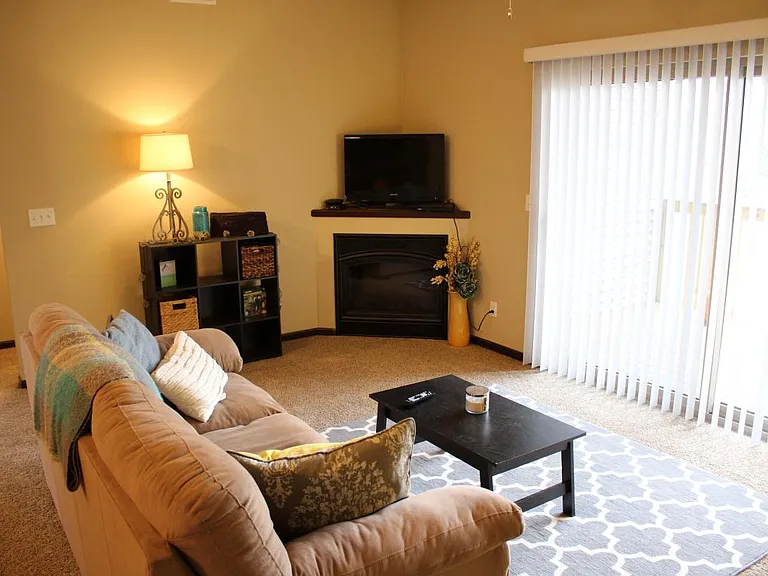 Living room w/ slider to deck