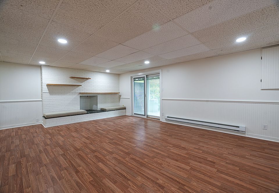 Private living space include beautiful decorative fireplace with shelving.
