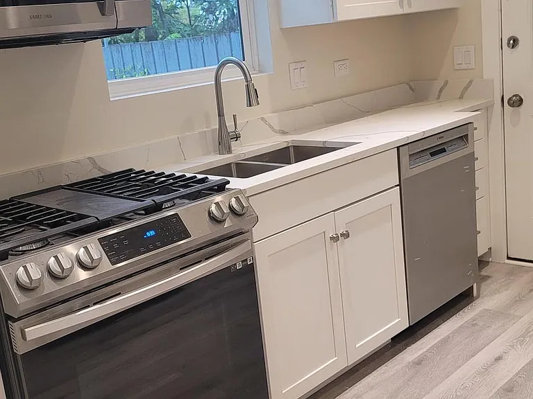 Partial Kitchen view with self-closing doors/drawers