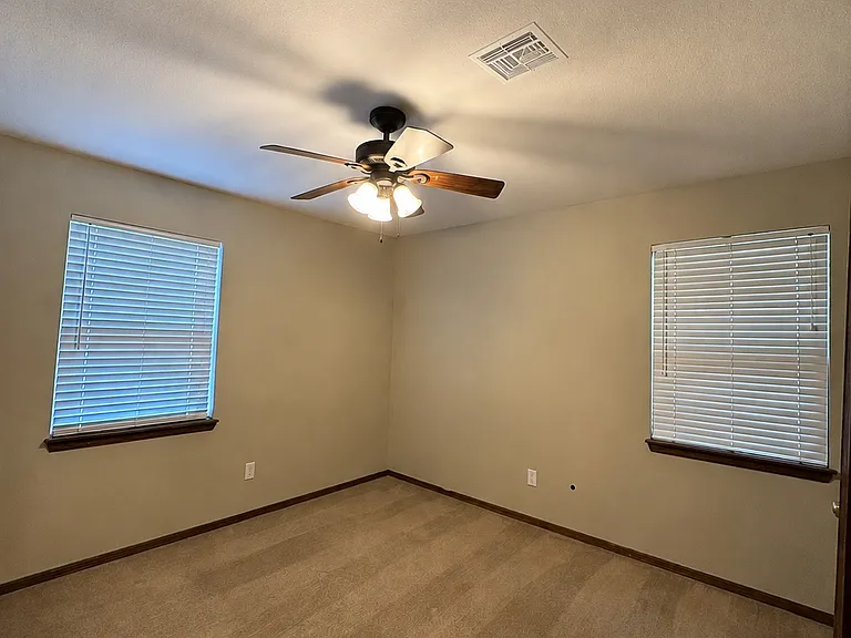 Primary bedroom - connected to the private half-bathroom.
