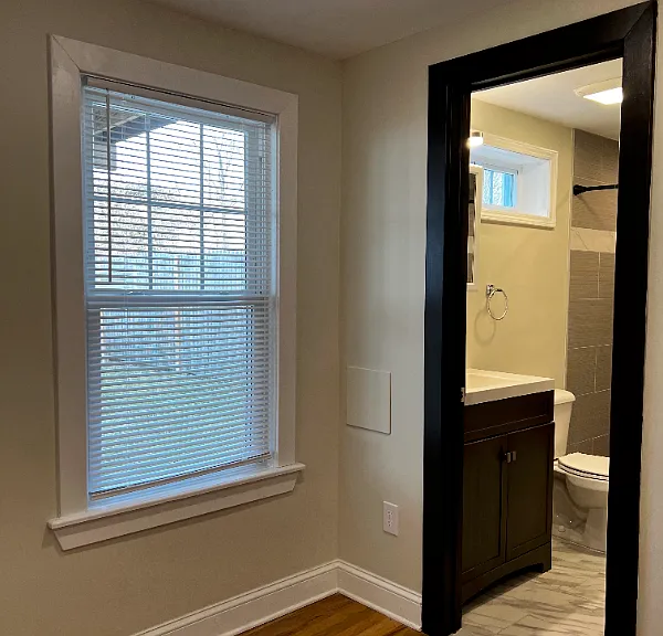 Updated bathroom with stone shower and window.