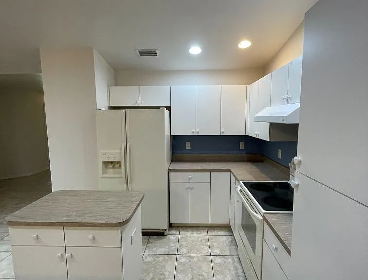 Kitchen with island and lots of storage