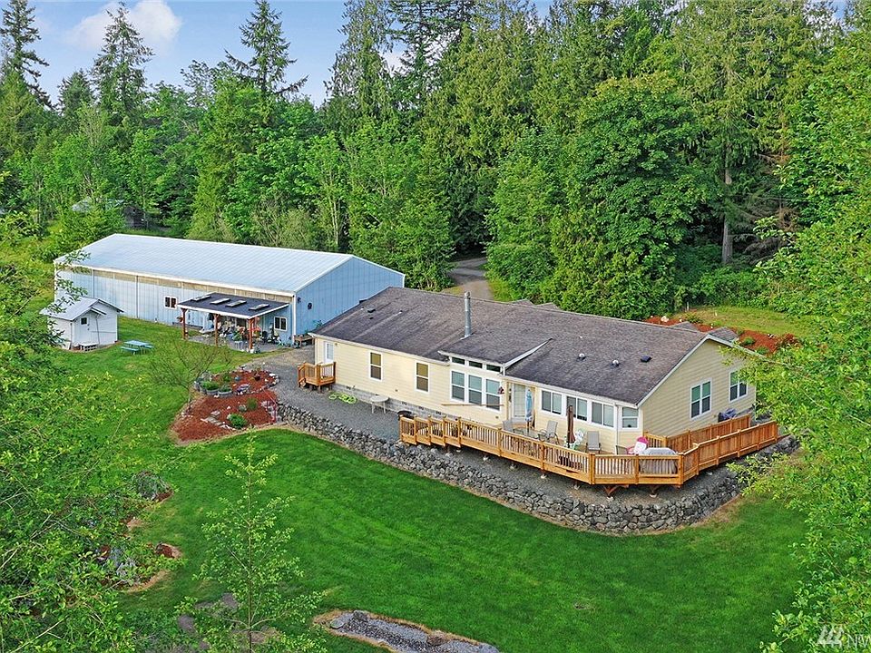 Large home, huge shop, 1-bd apt and over 15 acres to roam!
