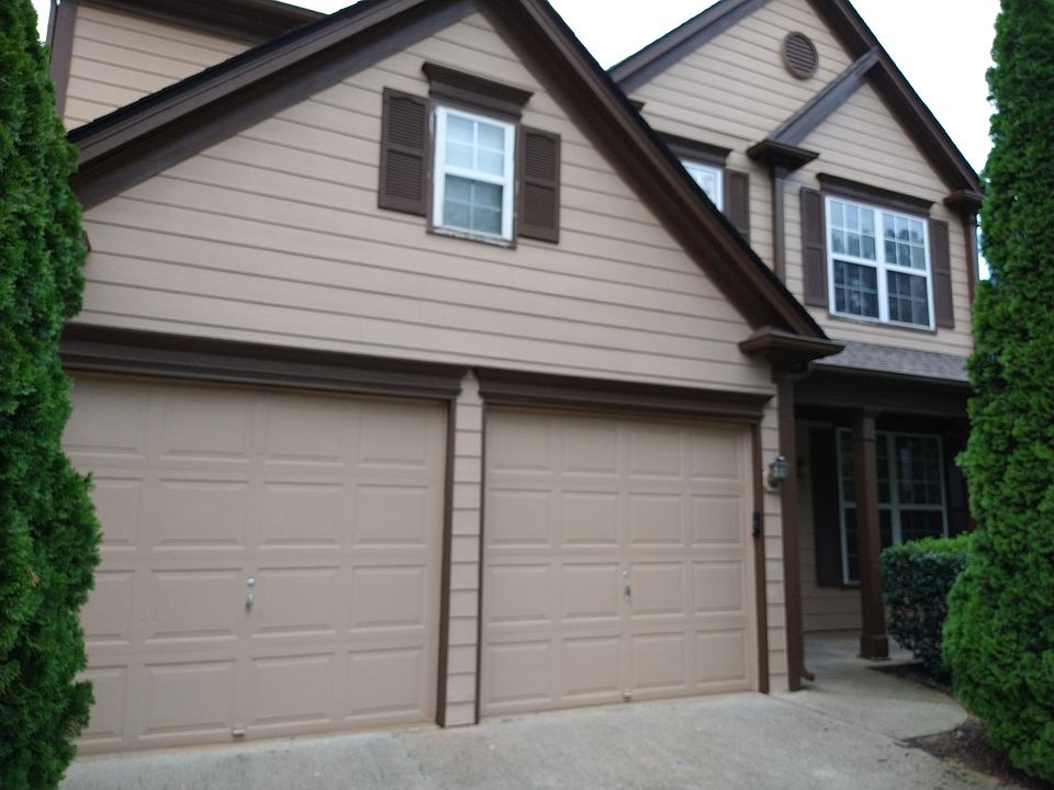 Front of the house with two car garages.