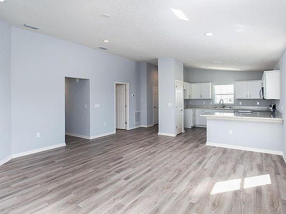 Enjoy a spacious and open living area with volume ceilings - Cambry home plan by Highland Homes