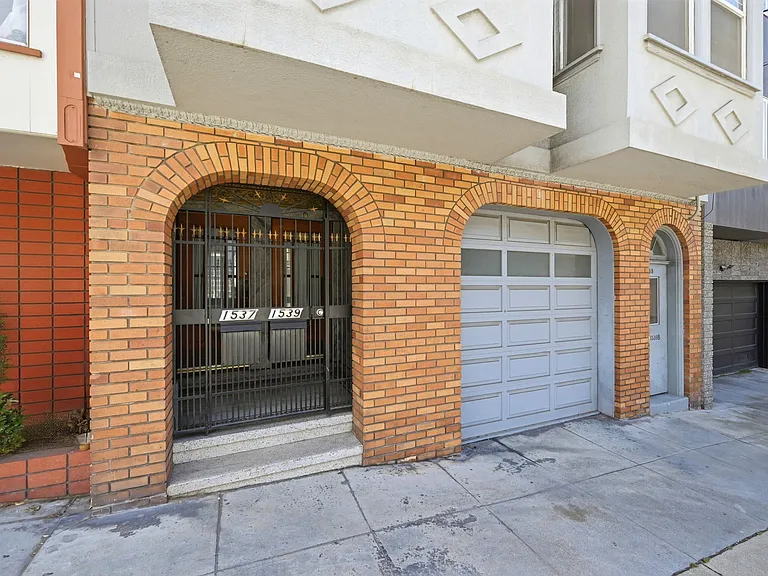 Entrance to 1537 Filbert. Black iron gate is locked for a secure entry. Entry is shared with 1539 Filbert.