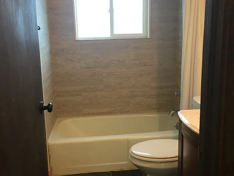 Lovely, stylish tile surrounding the tub.,
