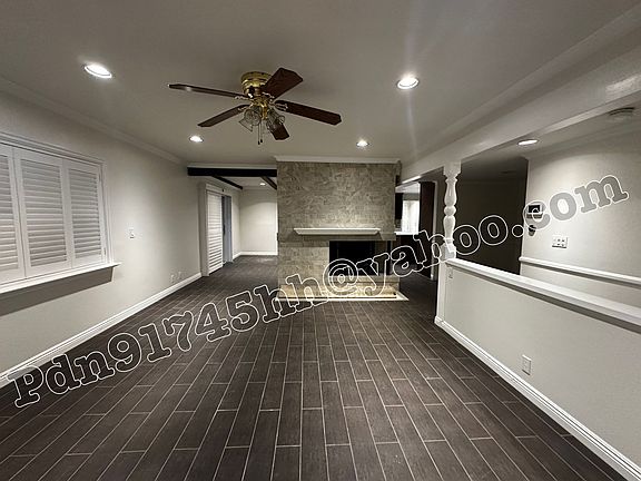 Living Room with Ceiling Fan & Fire place