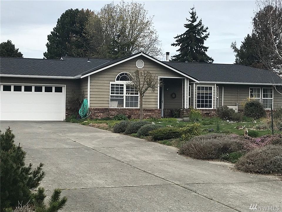Long paved driveway plus RV parking space beside garage. Covered front entry.  Roof new in 2018.