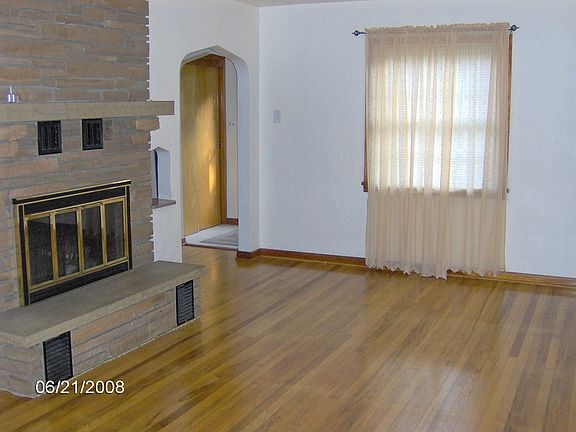 Living Room with glistening hardwood floors/fireplace