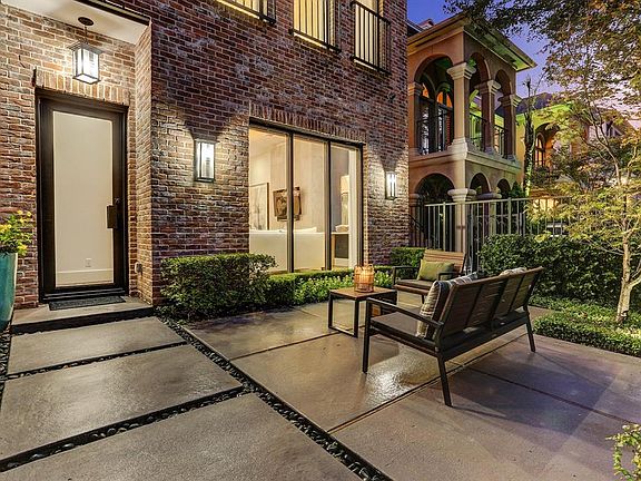 The quaint courtyard provides a sophisticated welcome for your guests. The landscaping is lit on a timer and the home features a sprinkler system for effortless maintenance.