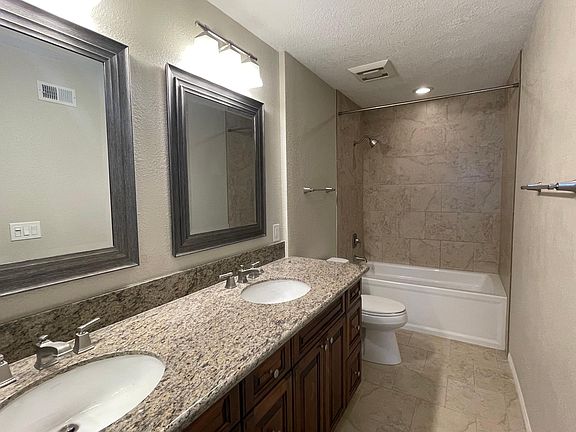 Main Bathroom with soaking tub and dual sinks